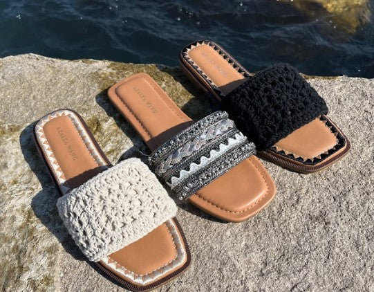 displaying three summer statement sandals, including one in black with a beaded upper, a black crochet sandal, a cream sandal with a crochet design