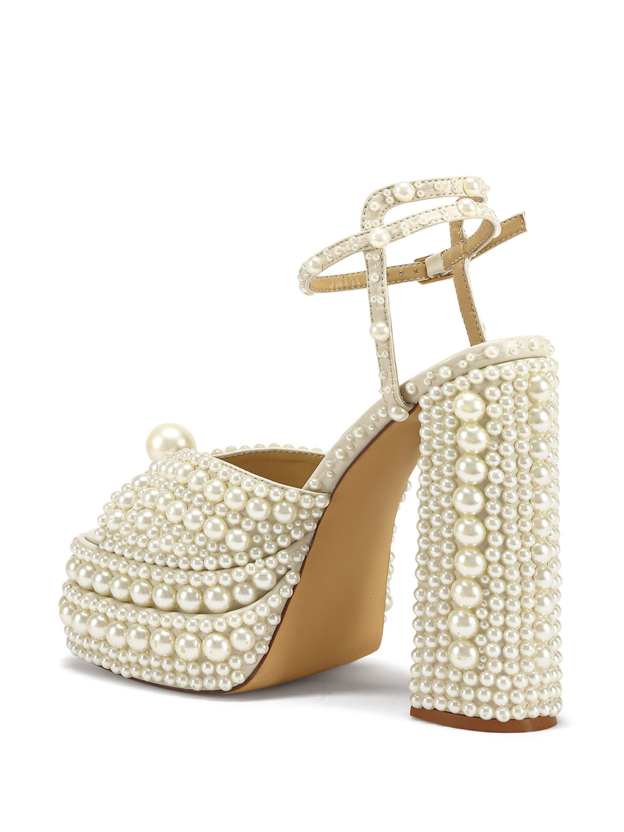faux pearl embellished platform statement heels with a peep toe and an adjustable ankle strap