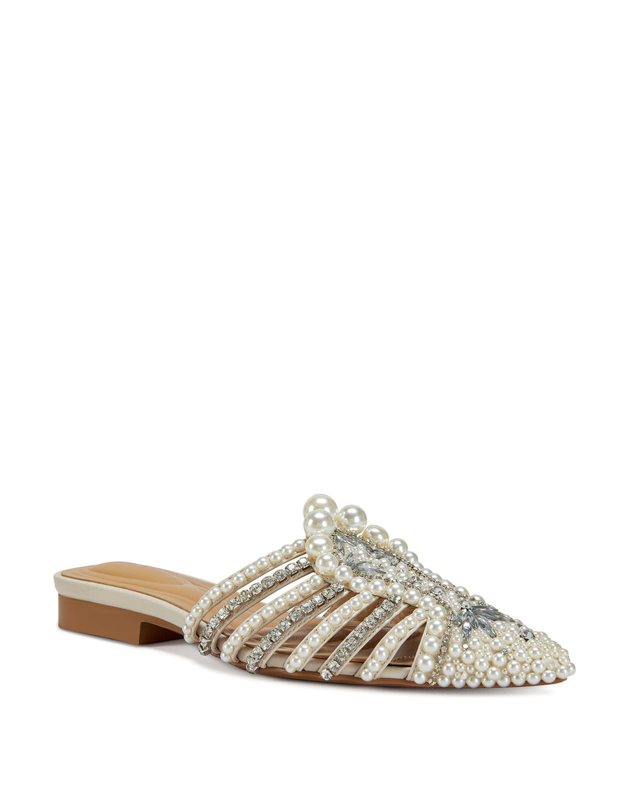 angled view of sparkly pointed toe slip on flat sandals with a caged upper lined with faux pearl and rhinestone embellishments