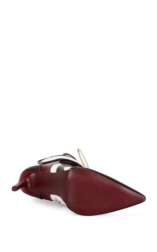 burgundy, brown, and white faux leather heeled boots with a mid calf length, lace up accent, and velcro belted accent with an inner zip up closure
