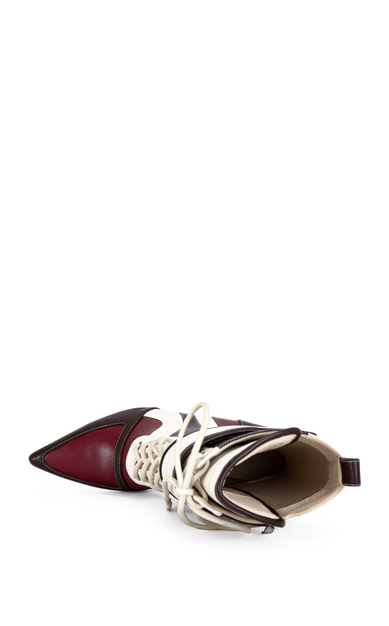 burgundy, brown, and white faux leather heeled boots with a mid calf length, lace up accent, and velcro belted accent with an inner zip up closure