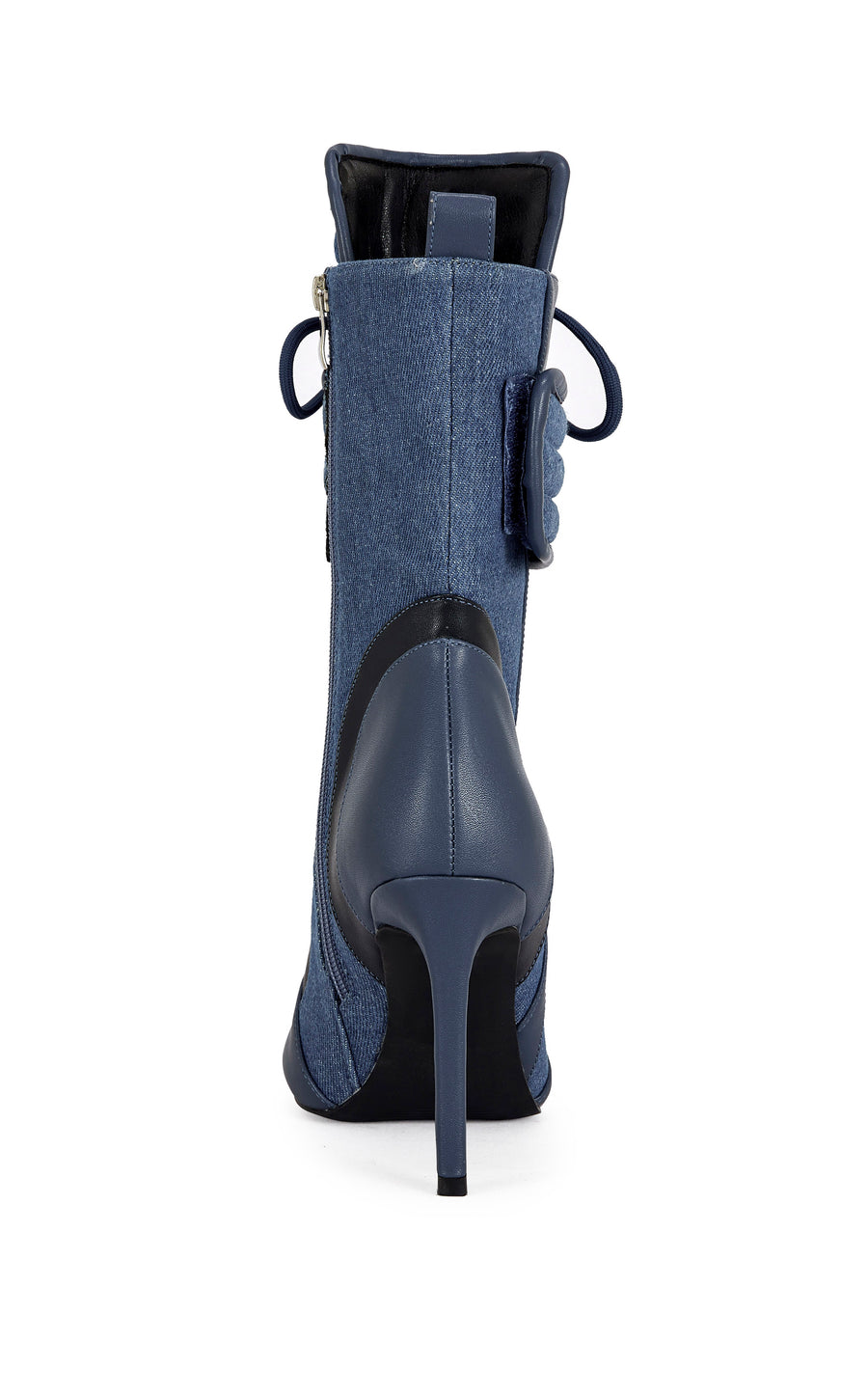 dark wash denim and navy blue faux leather heeled boots with a mid calf length, lace up accent, and velcro belted accent with an inner zip up closure