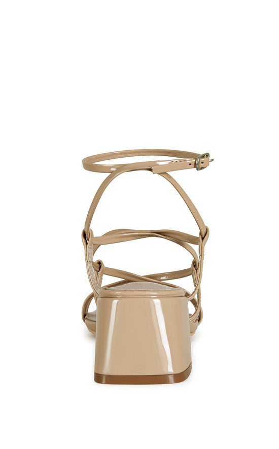 beige faux leather strappy sandals with a square block heel and an adjustable ankle strap