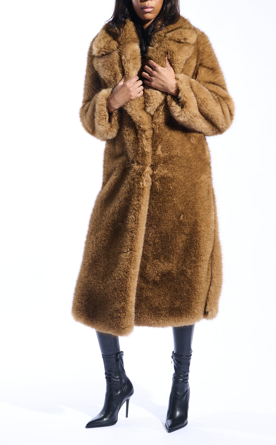 light brown faux fur statement trench coat with an oversized collar and pockets on the front sides