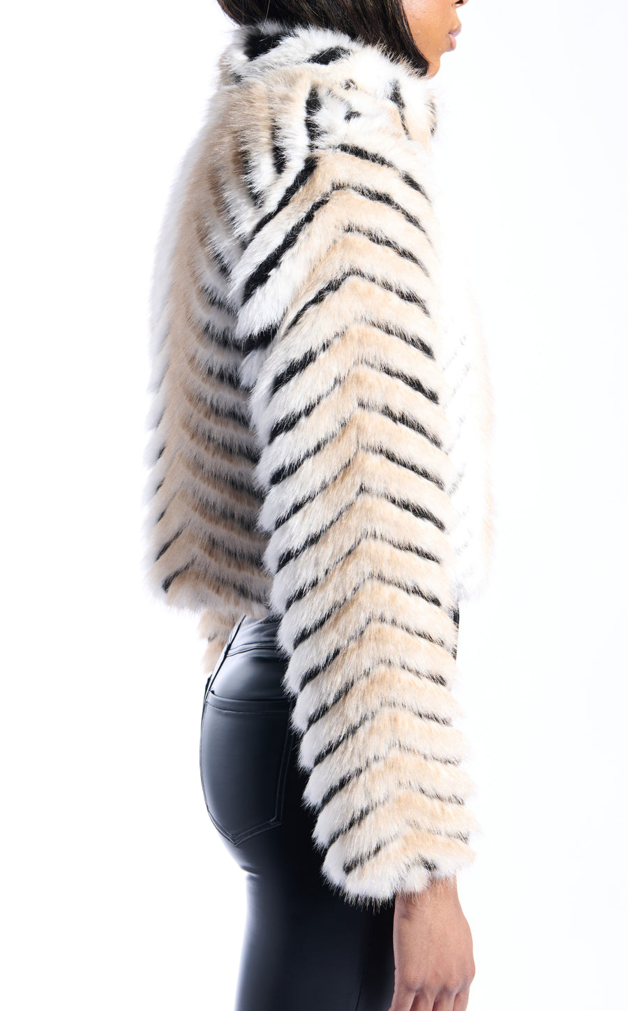 black and beige stripe print faux fur statement coat with a cropped silhouette and adjustable western inspired belt closure accents