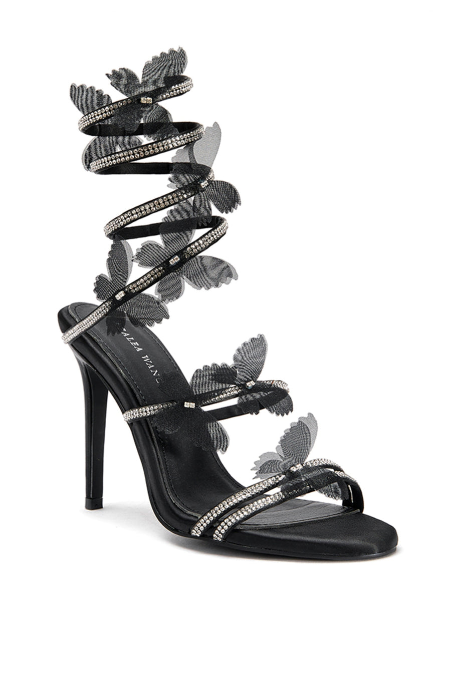 Side view of Black stiletto heels with crystal embellished wrap up detail and tulle butterfly accents on the straps