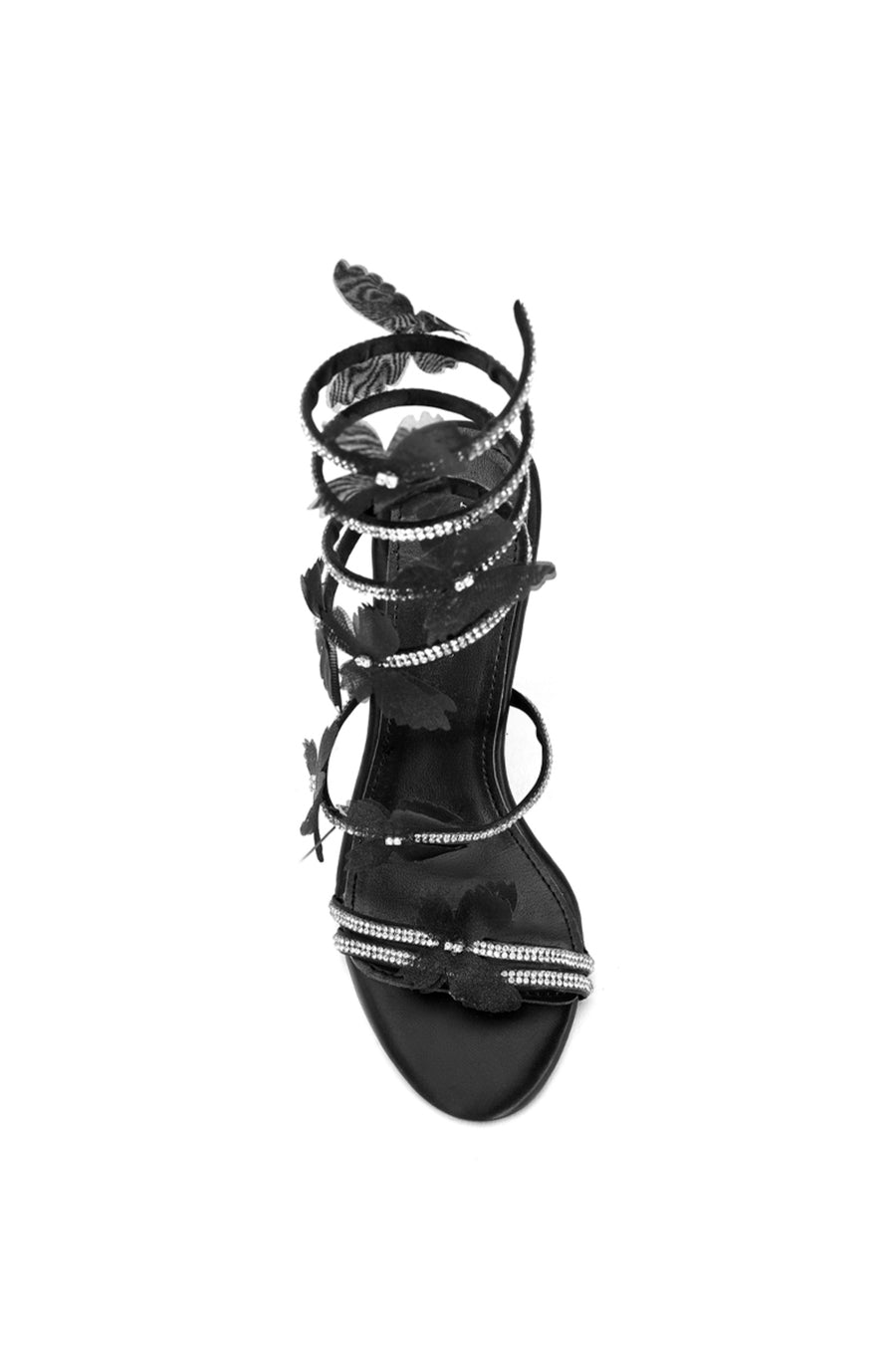 top view of Black stiletto heels with crystal embellished wrap up detail and tulle butterfly accents on the straps