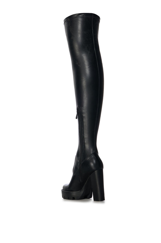 black platform thigh high boots with a block heel and a lug sole