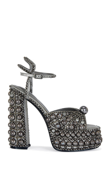 platform heeled peep toe statement heels with hematite pearl embellishments all over the heel, finished with an adjustable ankle strap
