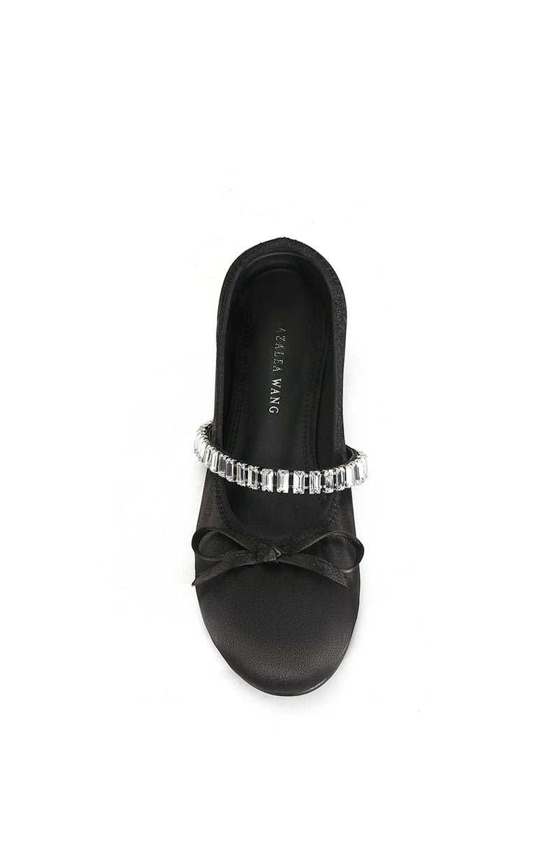 top view of black ballet flat with a subtle bow accent on the front and a crystal rhinestone embellished strap