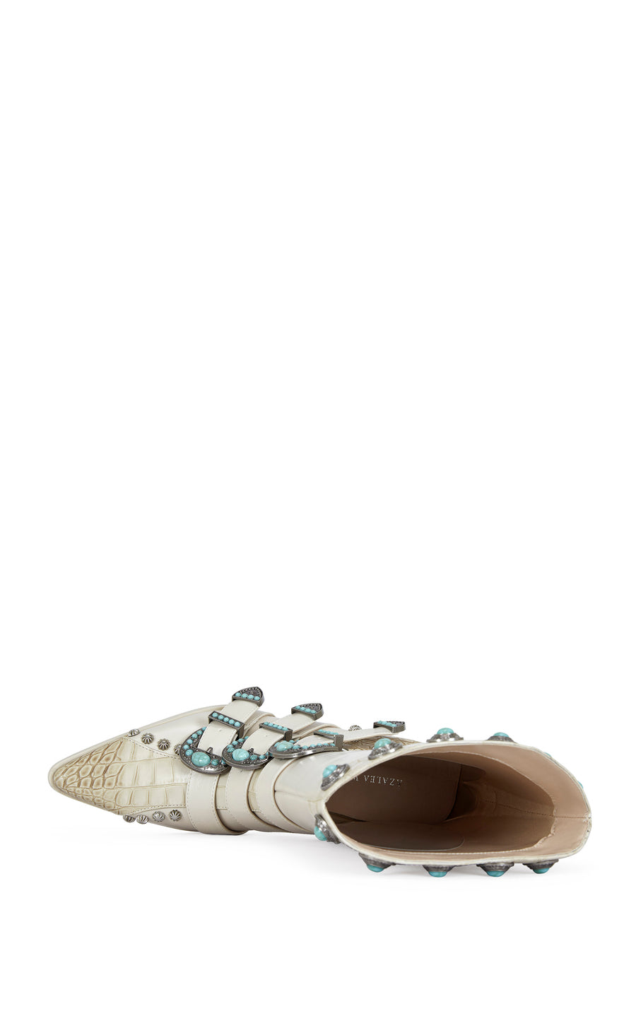 bone faux leather and beige faux snakeskin statement western booties with western belted accents finished with turquoise and silver studded accents.