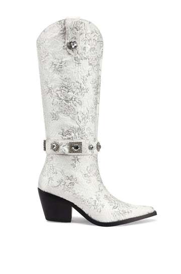 white satin floral print statement western boot with crystal embellished belted accents and a black block heel