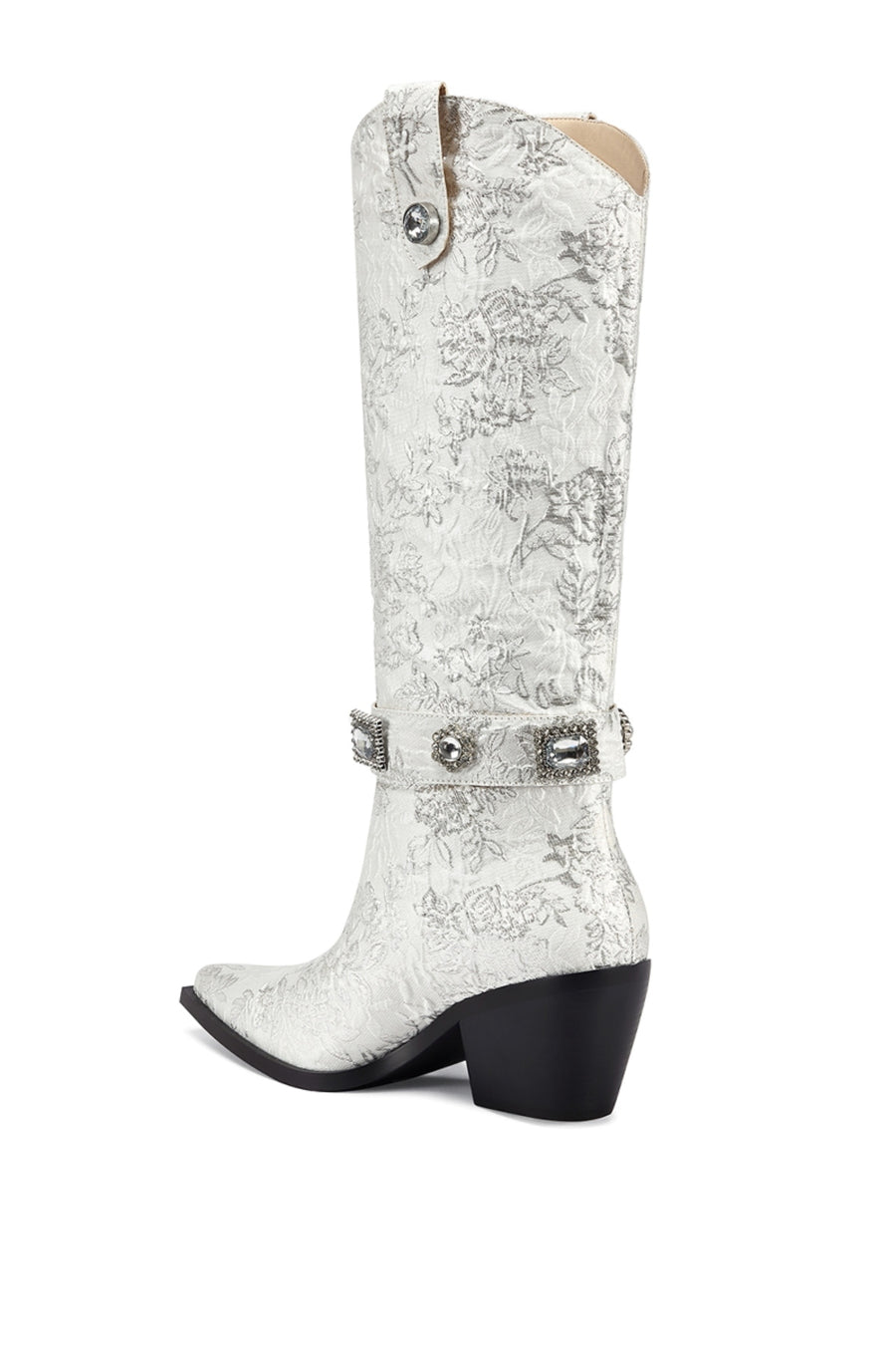 back view of white satin floral print statement western boot with crystal embellished belted accents and a black block heel
