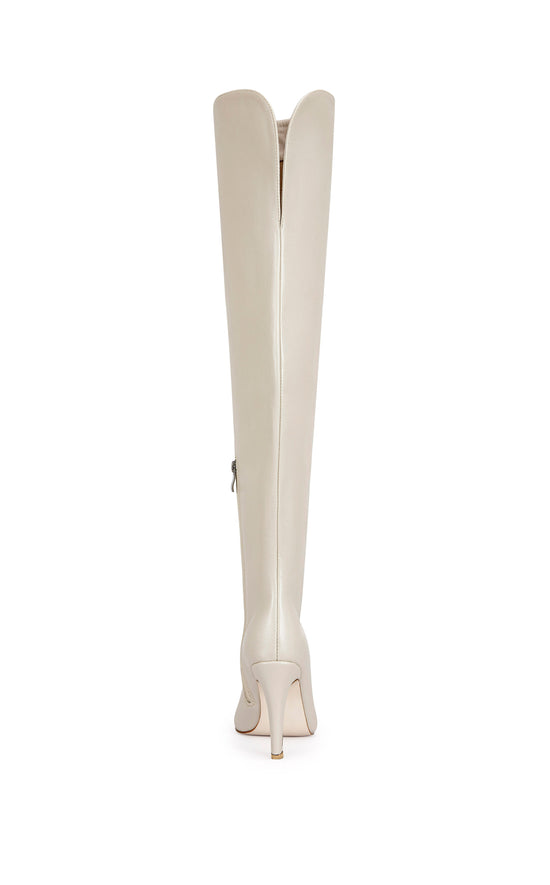 bone faux leather thigh high boots with a stiletto heel and pointed toe silhouette