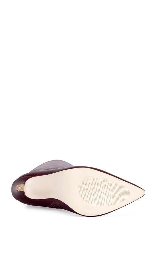 burgundy faux leather thigh high boots with a stiletto heel and pointed toe silhouette