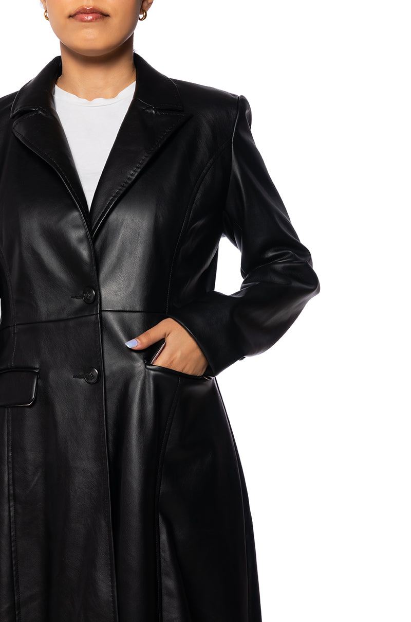 detail shot of black faux leather trench coat with button closure and pocket accent