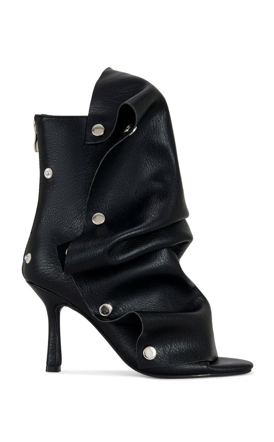 black faux leather stiletto peep-toe bootie with a slouch overlay and functional snaps that give an edgy look