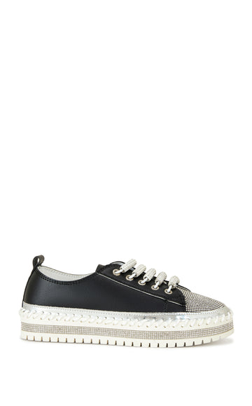 black faux leather statement sneakers with a white platform sole and a crystal embellished toe and side of the sole