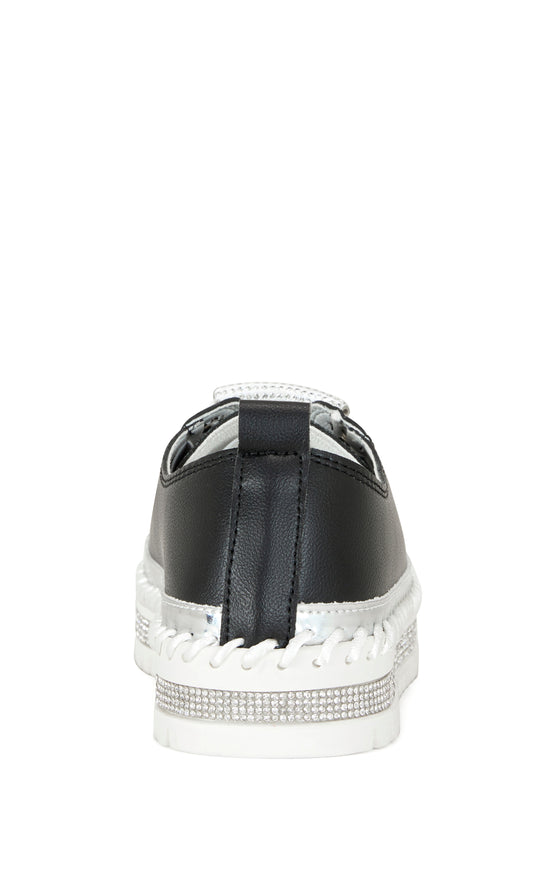 black faux leather statement sneakers with a white platform sole and a crystal embellished toe and side of the sole
