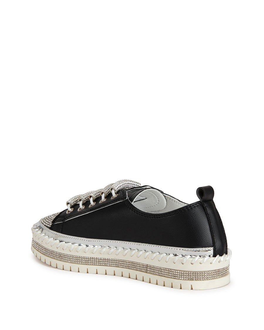 back view of black faux leather statement sneakers with a white platform sole and a crystal embellished toe and side of the sole