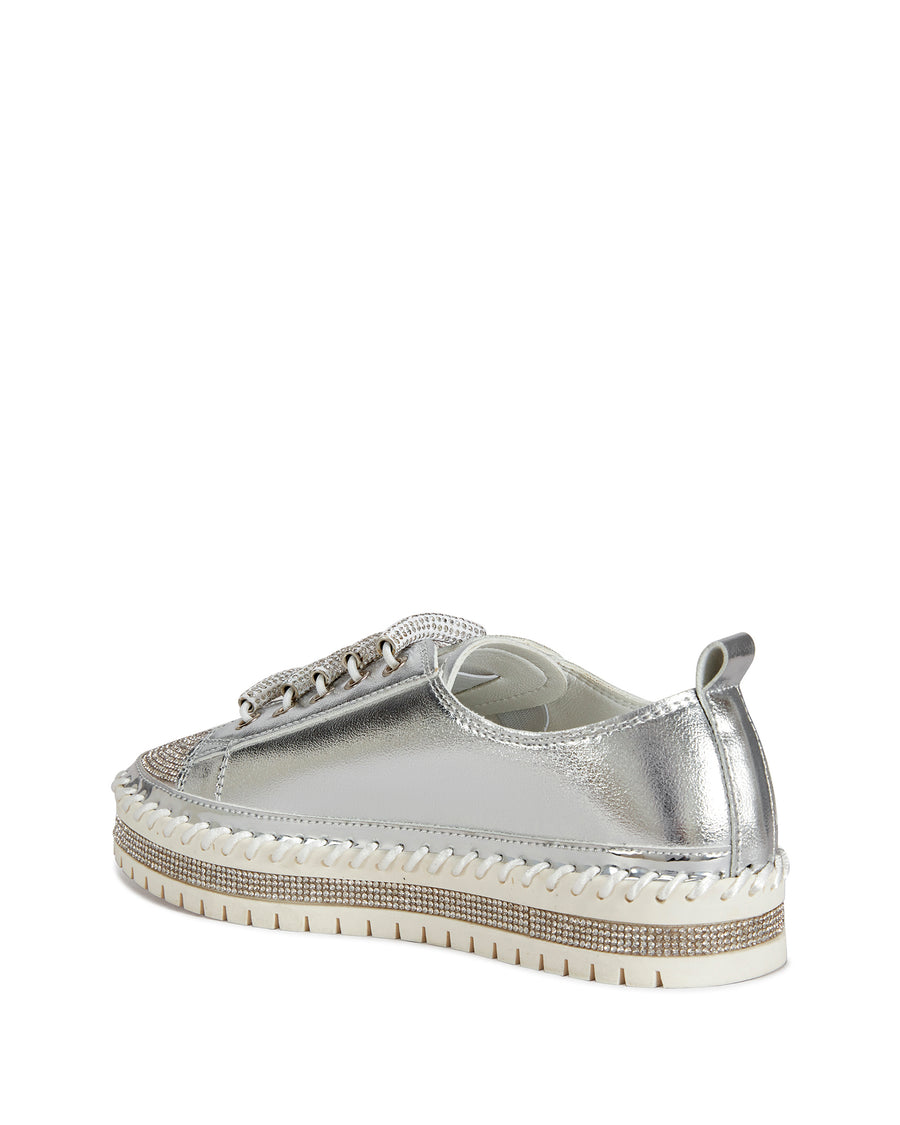 back view of metallic silver faux leather statement sneakers with a white platform sole and a crystal embellished toe and side of the sole