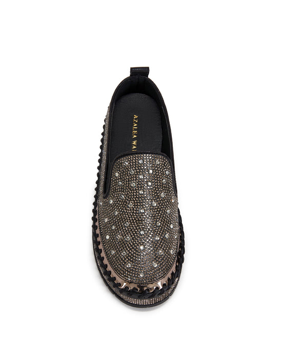 black slip on espadrille sneakers with a gold rhinestone embellished upper and a chunky black platform sole