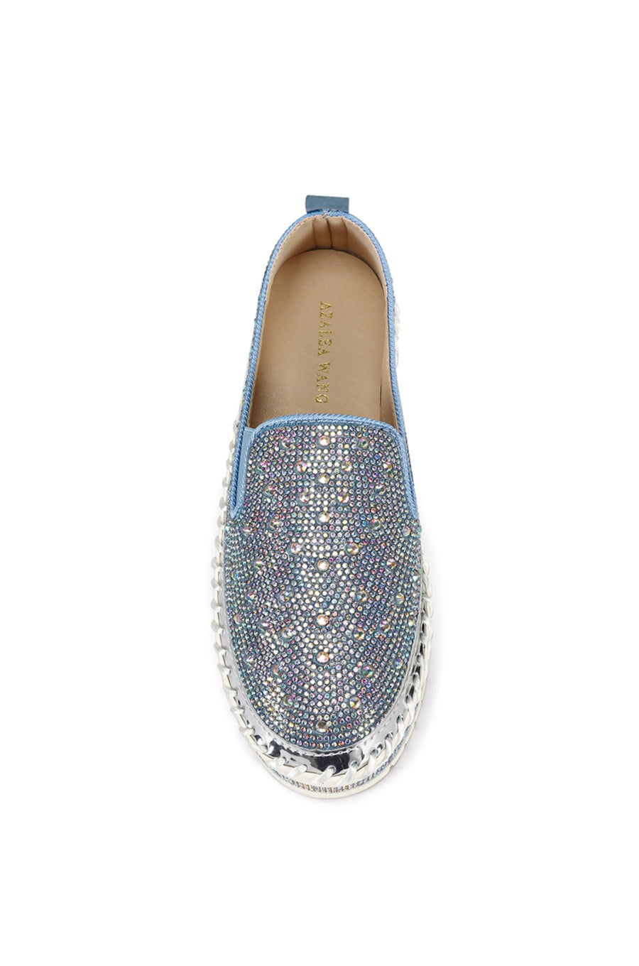 top view of slip on light wash denim flat sneakers with crystal rhinestone embellishments and a white braided platform sole