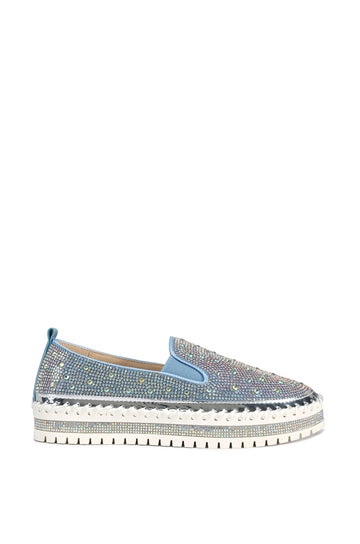 slip on light wash denim flat sneakers with crystal rhinestone embellishments and a white braided platform sole