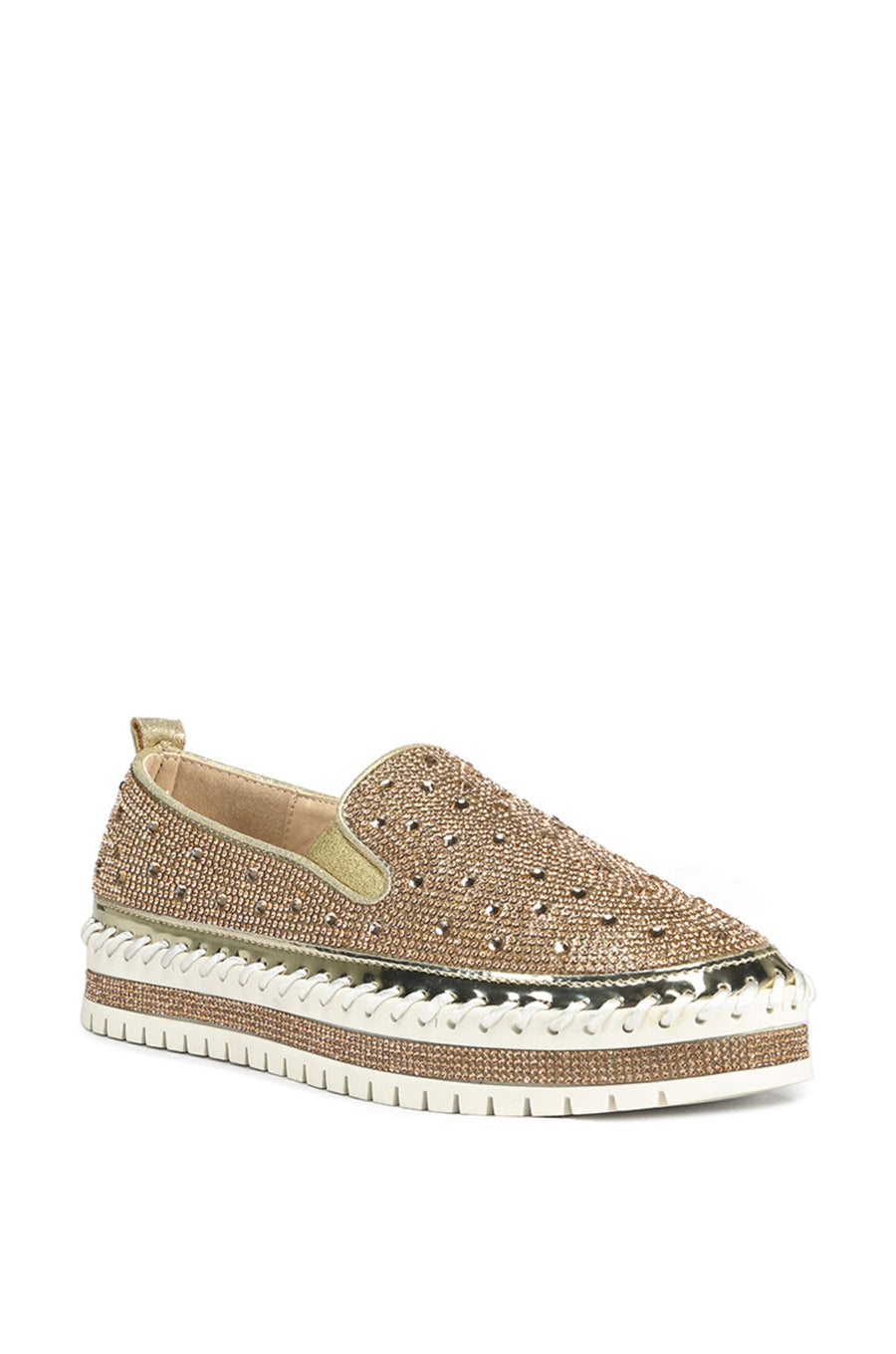 angled view of slip on metallic rose gold flat sneakers with crystal rhinestone embellishments and a white braided platform sole