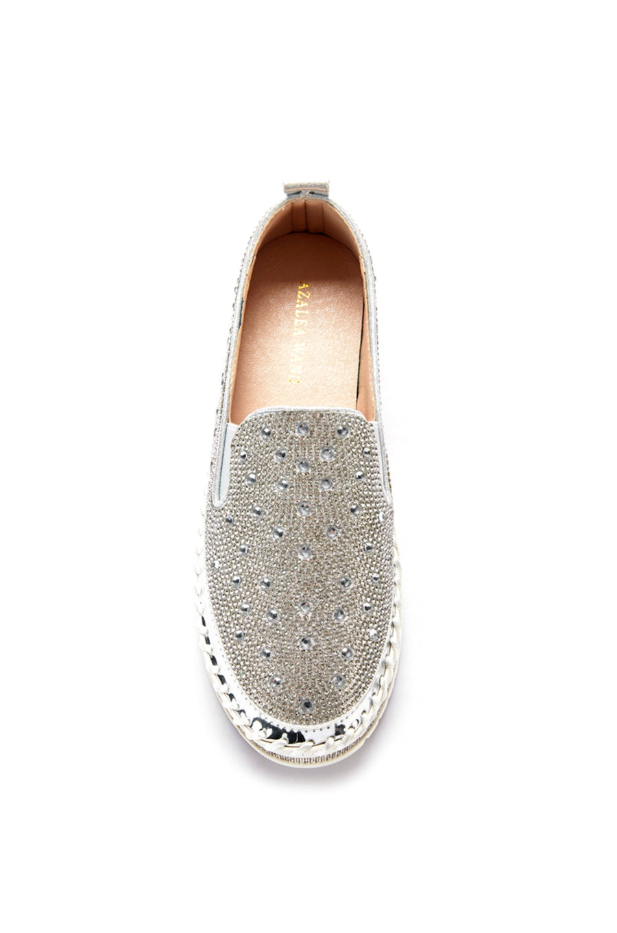top view of slip on metallic silver flat sneakers with crystal rhinestone embellishments and a white braided platform sole