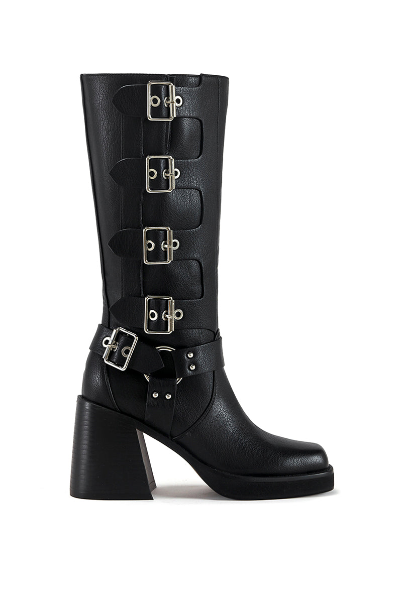 black faux leather moto boot with a black block heel and silver hardware belted accents along the shaft