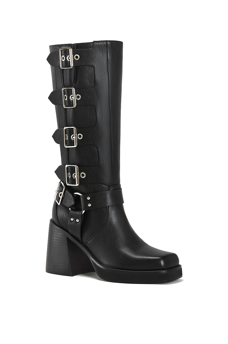 angled view of black faux leather moto boot with a black block heel and silver hardware belted accents along the shaft