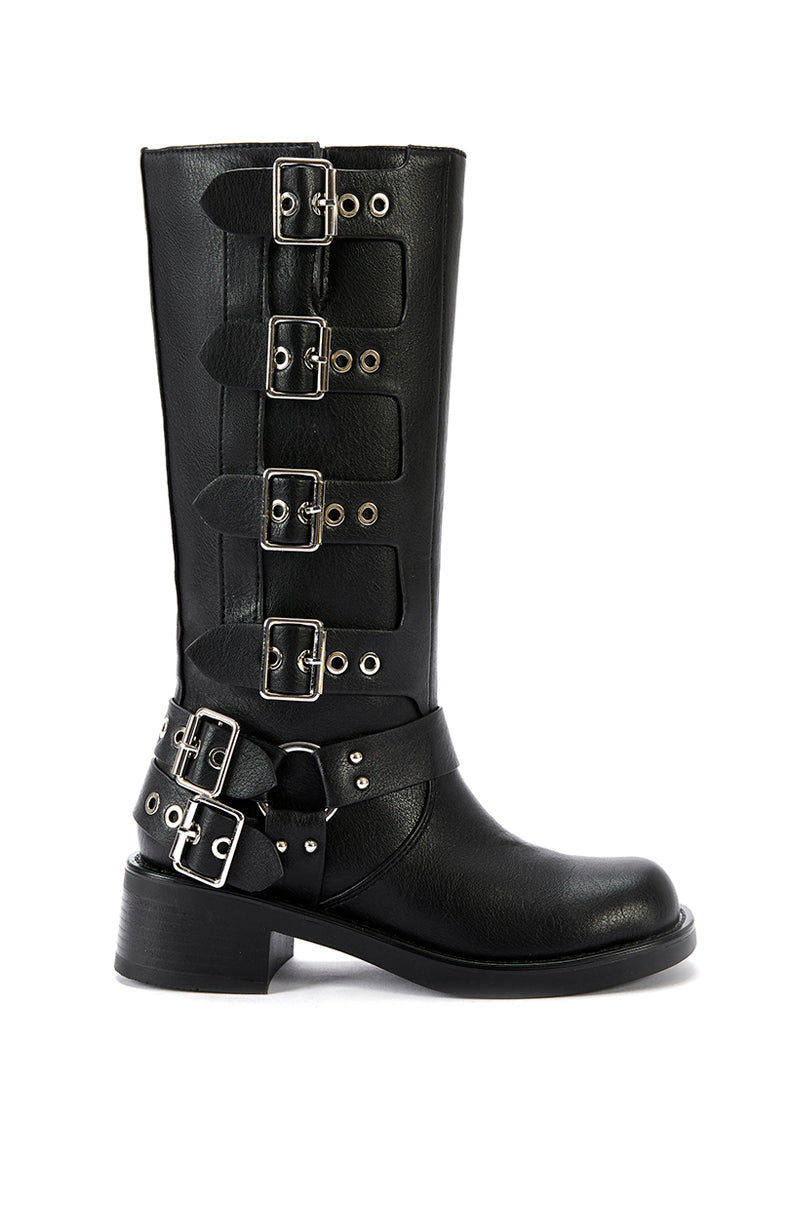 side view of mid calf length black  faux leather boots with a rounded toe, small block heel, and silver buckle design going up the shoe