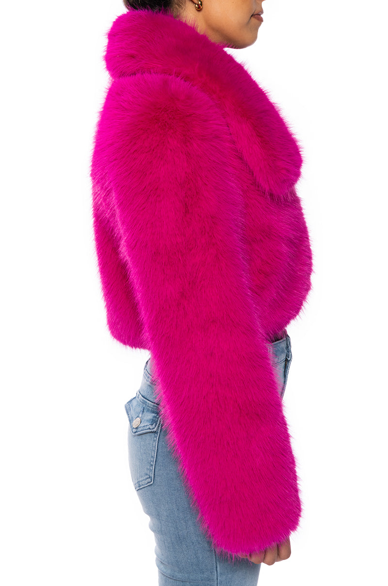 side view of luxurious pink faux fur cropped jacket