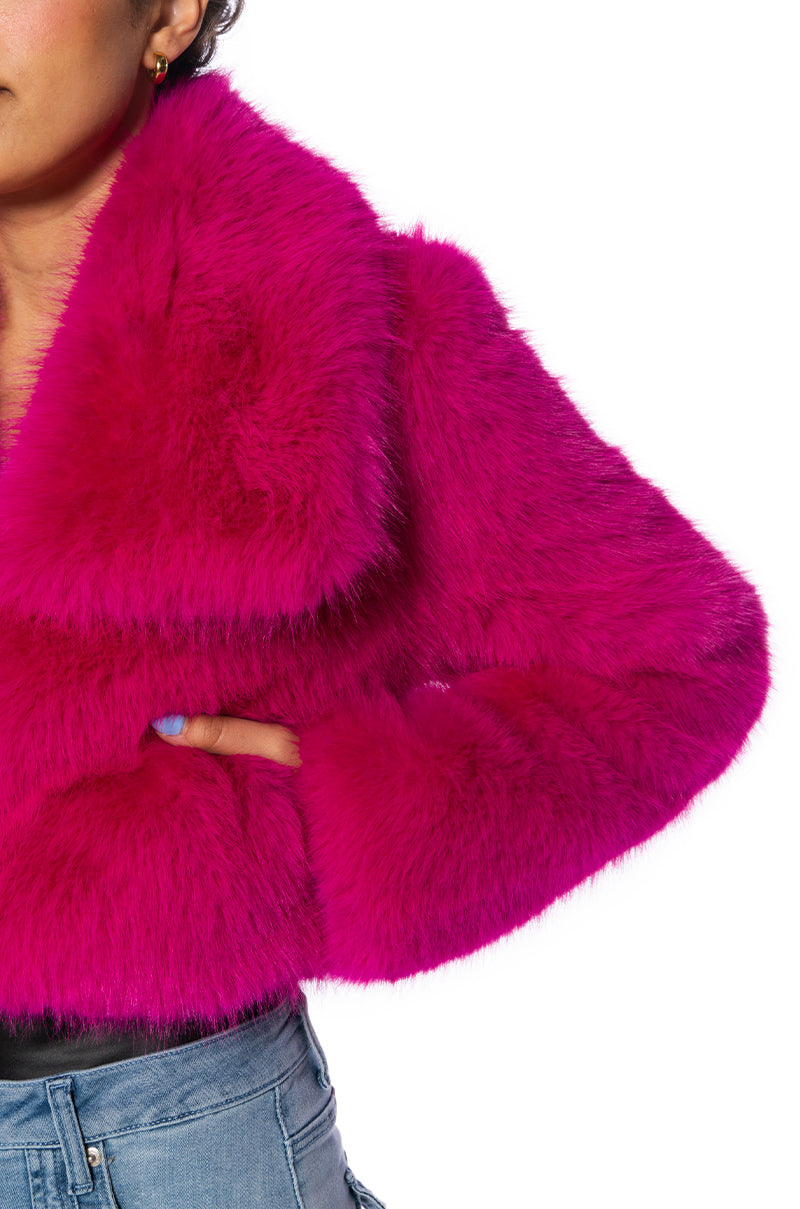 detail shot of luxurious pink faux fur cropped jacket