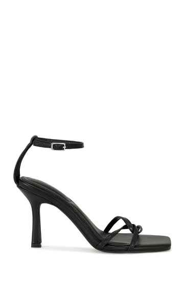 black faux leather open toe strappy sandals with a stiletto heel and adjustable ankle strap