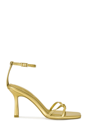 gold faux leather open toe strappy sandals with a stiletto heel and adjustable ankle strap