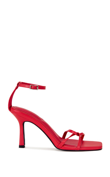 red faux leather open toe strappy sandals with a stiletto heel and adjustable ankle strap