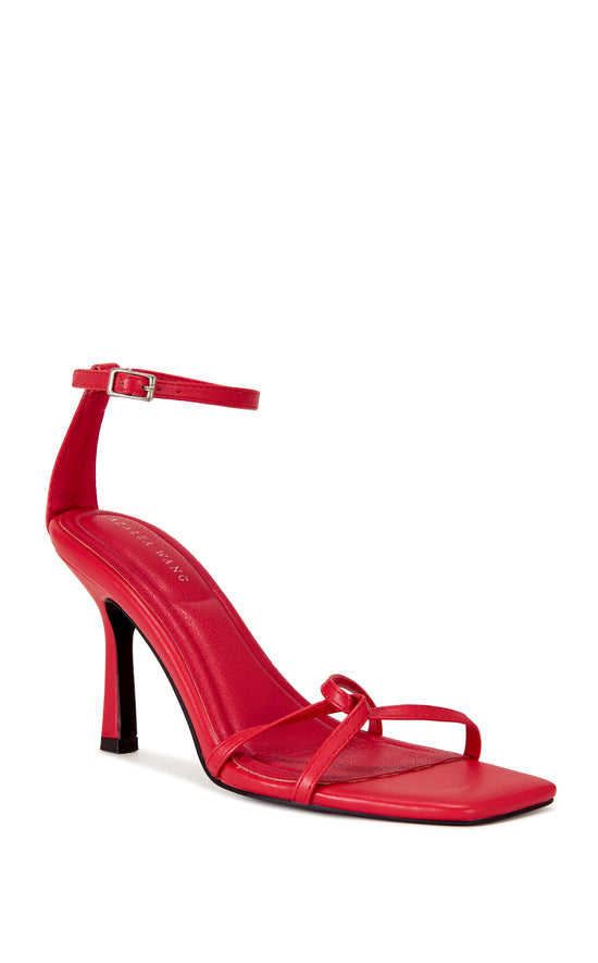 red faux leather open toe strappy sandals with a stiletto heel and adjustable ankle strap