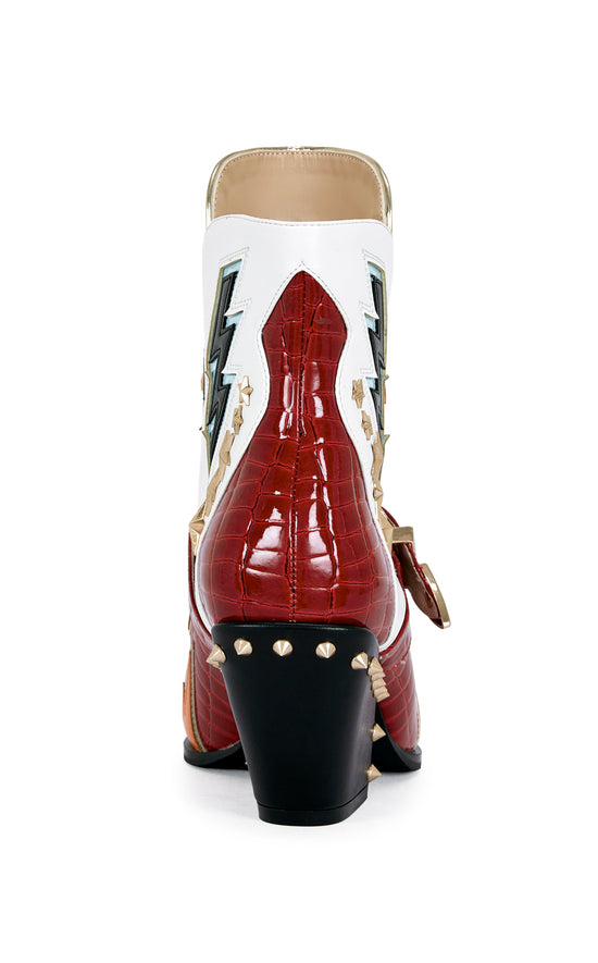 red and white faux leather statement ankle booties with lightning and star accents, with a studded block heel
