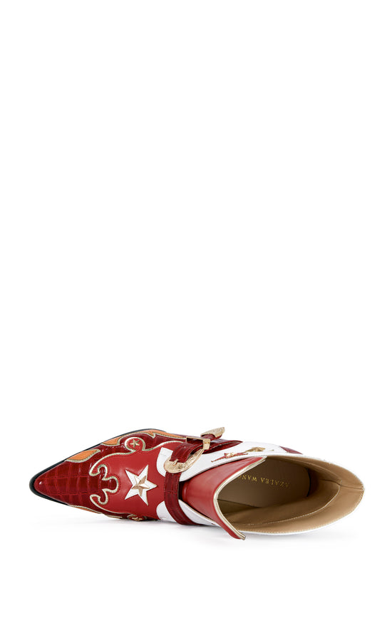 red and white faux leather statement ankle booties with lightning and star accents, with a studded block heel