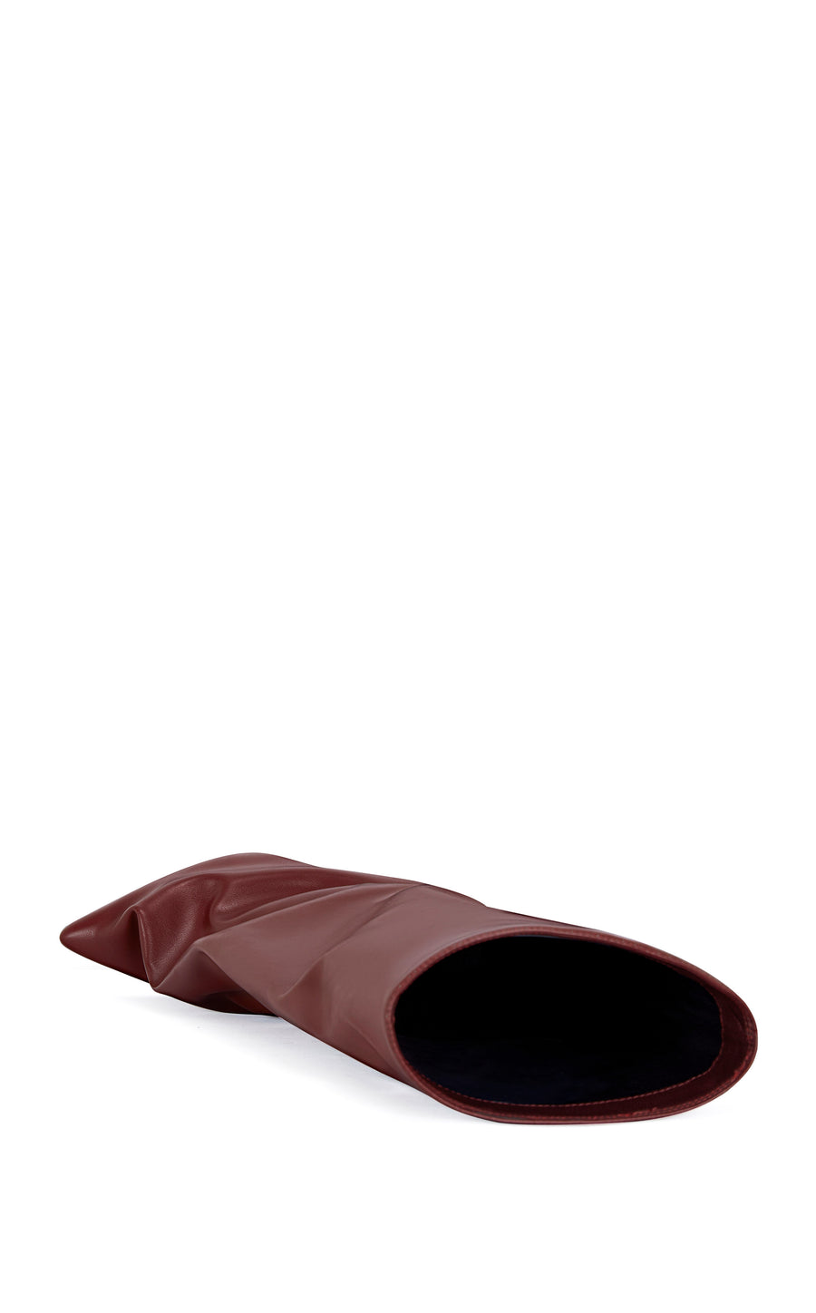 wine red faux leather knee high boot with a pointed toe, stiletto heel, and a slouched shaft