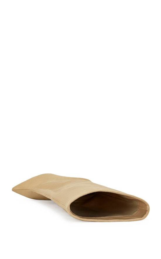 beige faux suede knee high boot with a pointed toe, stiletto heel, and a slouched shaft