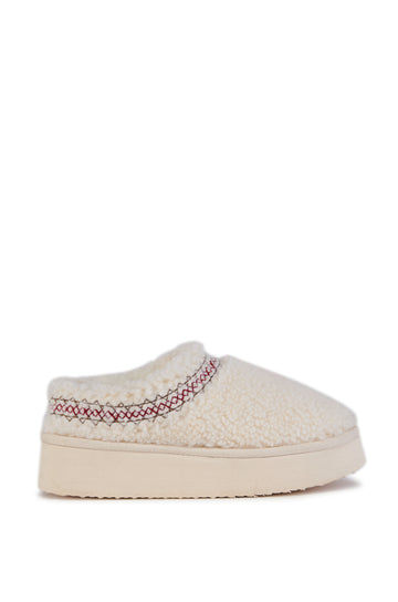 platform cream fuzzy slippers with a stitching design around the slipper opening