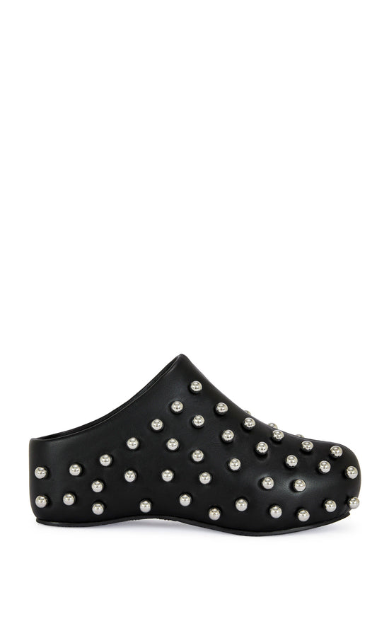 black faux leather statement mule with a sip on fit and circular stud embellishments on the upper