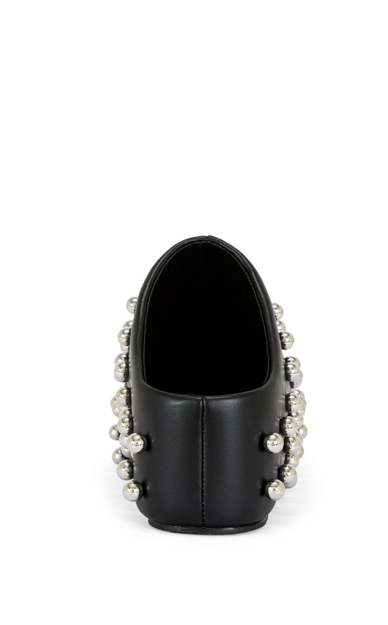 black faux leather statement mule with a sip on fit and circular stud embellishments on the upper