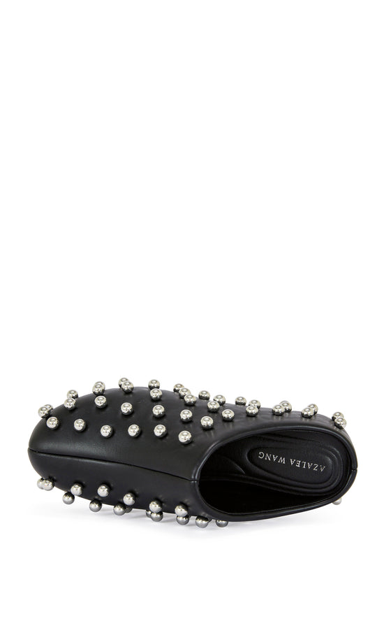 black faux leather statement mule with a sip on fit and circular stud embellishments on the upper
