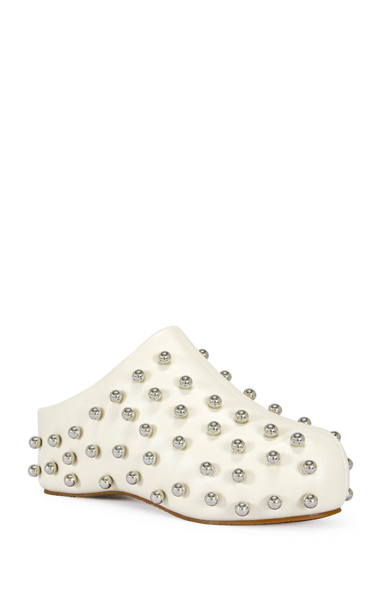 cream faux leather statement mule with a sip on fit and circular stud embellishments on the upper