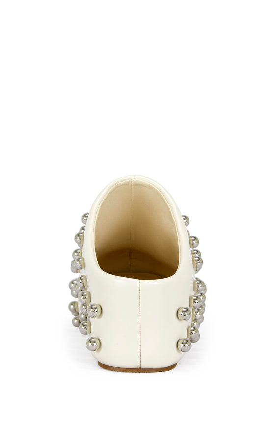 cream faux leather statement mule with a sip on fit and circular stud embellishments on the upper