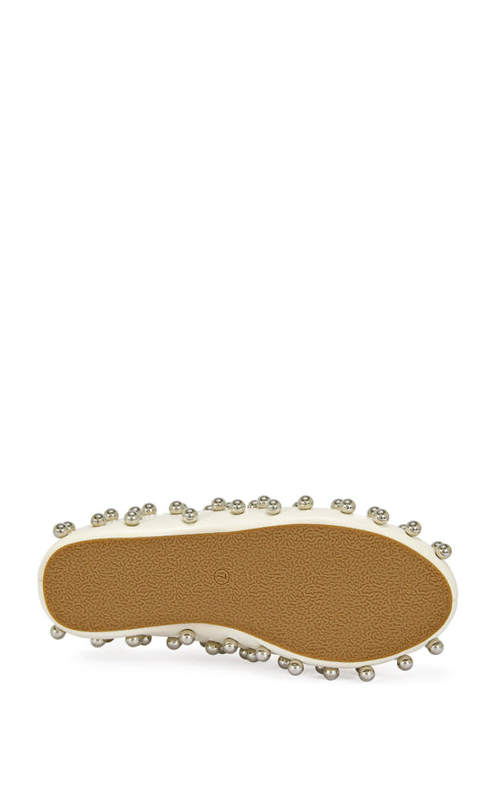 cream faux leather statement mule with a sip on fit and circular stud embellishments on the upper
